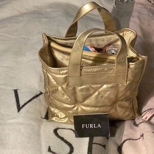 10 x 8 lather gold Furla purse one pocket two handles
